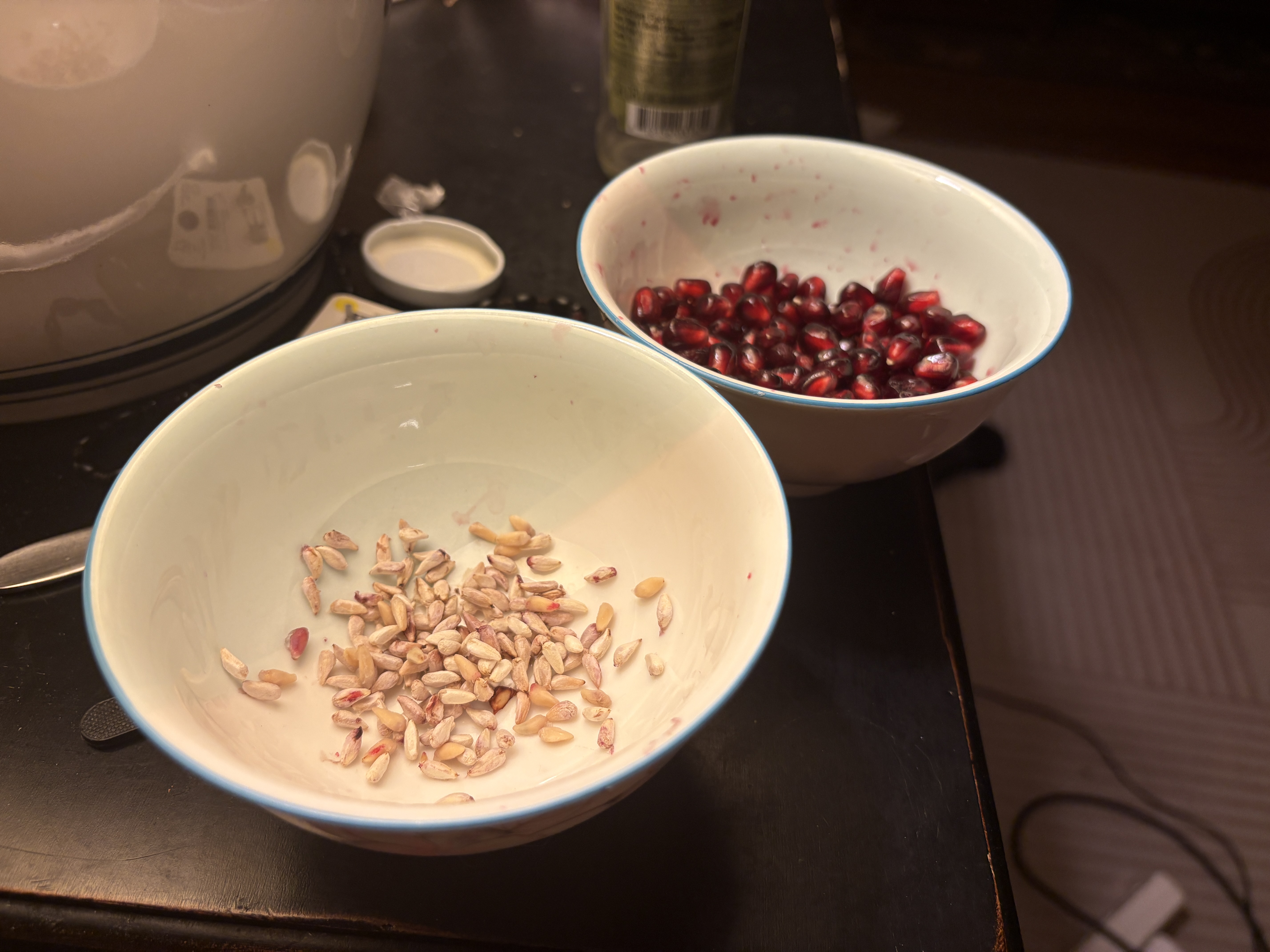 Some pomegranate seeds and arils on Frank Hu's nightstand